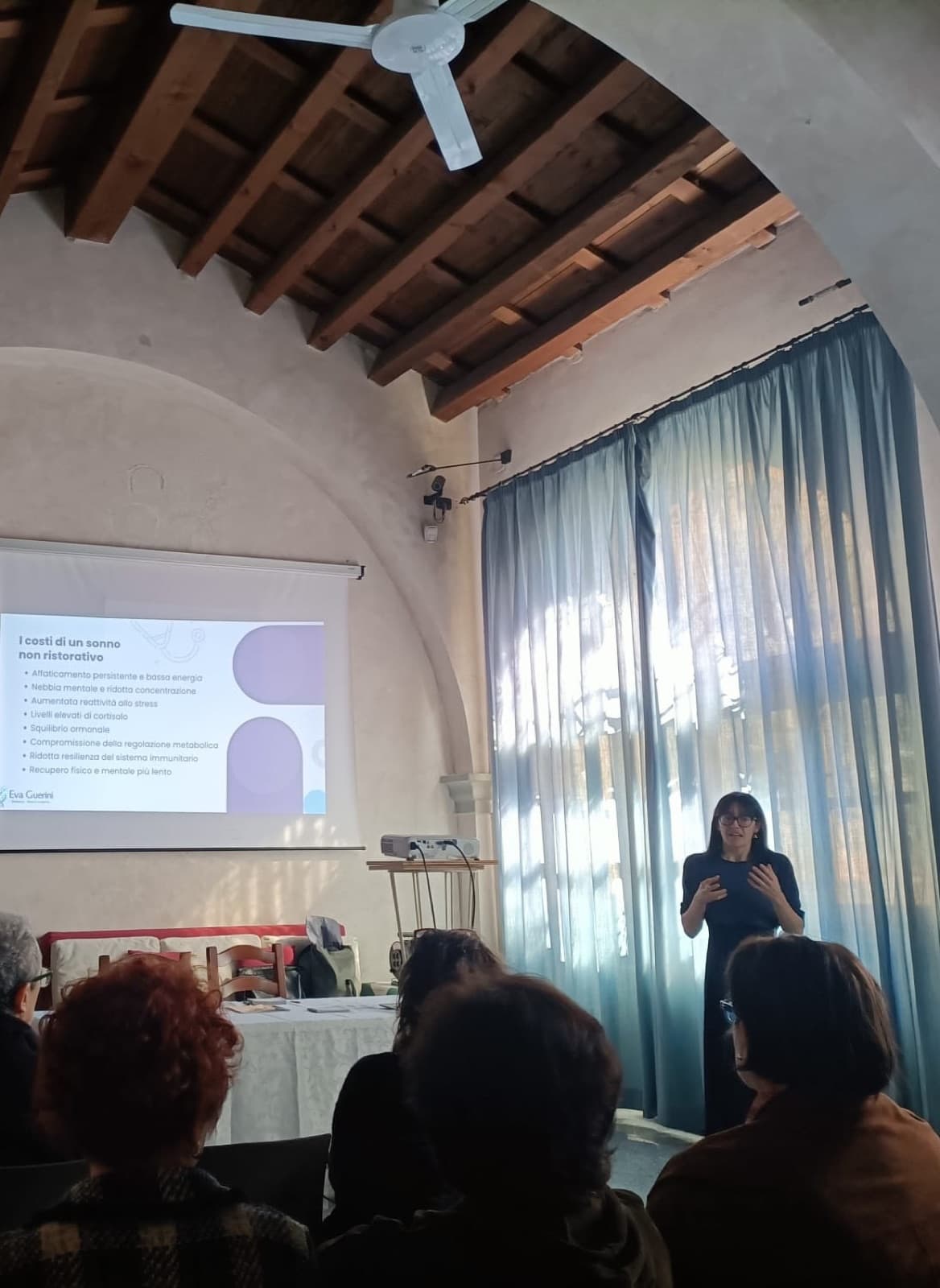 Eva speaking at an event
